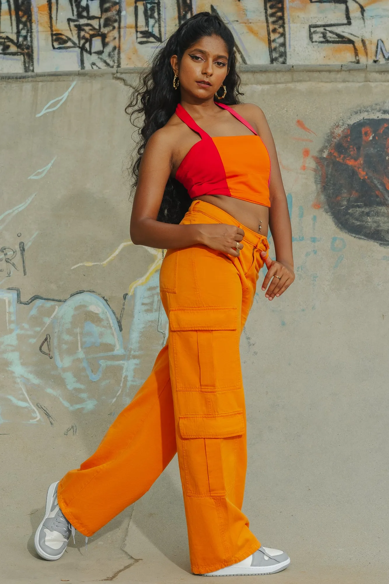 Sure! To optimize the title for better searchability and appeal, we can include descriptors that highlight the products features, style, and potential use cases. Heres an optimized title:

Trendy Candy Orange High-Waisted Cargo Pants for Women - Stylish and Functional Streetwear