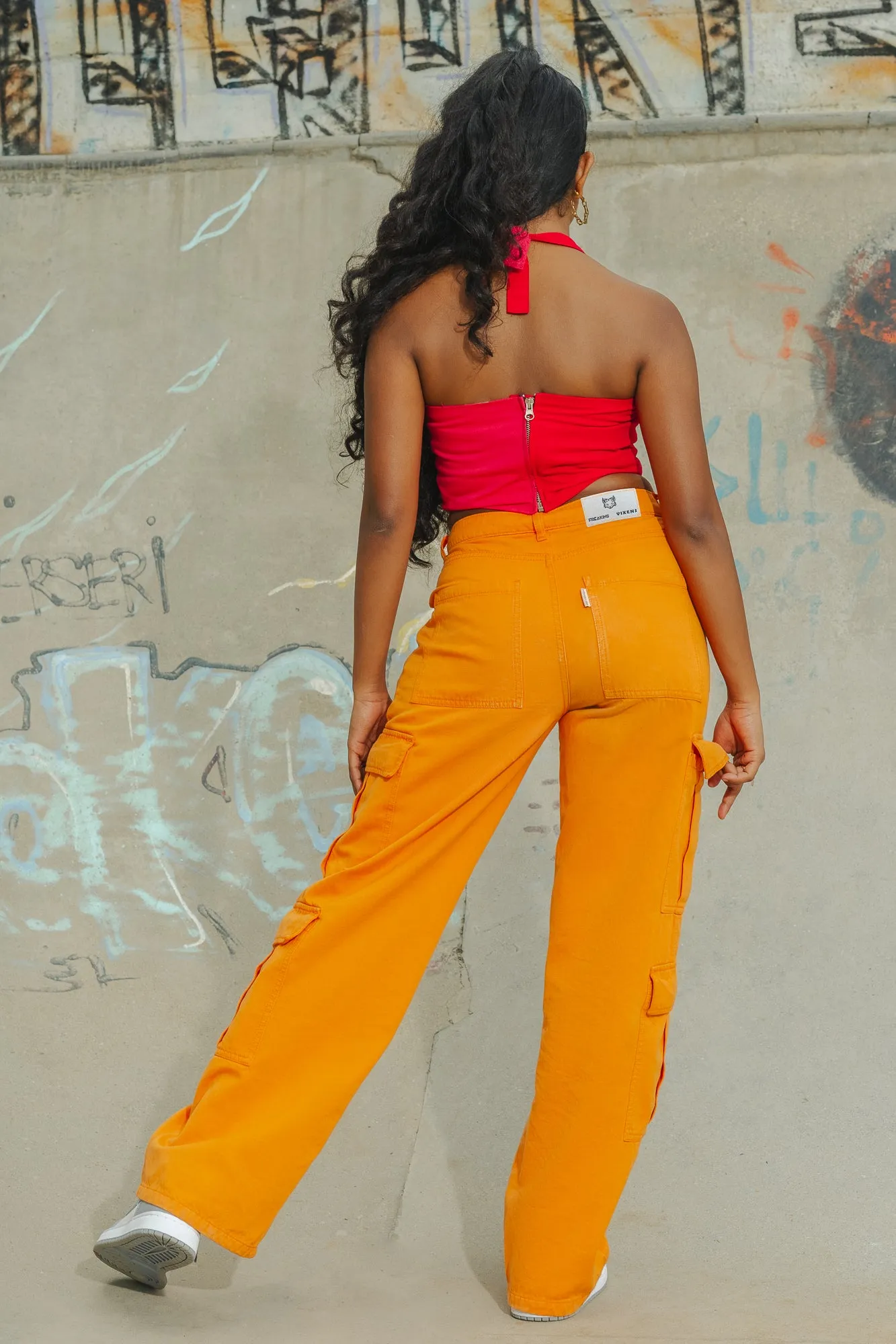 Sure! To optimize the title for better searchability and appeal, we can include descriptors that highlight the products features, style, and potential use cases. Heres an optimized title:

Trendy Candy Orange High-Waisted Cargo Pants for Women - Stylish and Functional Streetwear