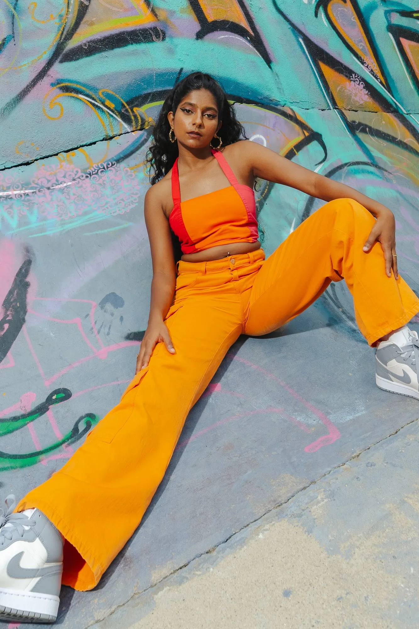 Sure! To optimize the title for better searchability and appeal, we can include descriptors that highlight the products features, style, and potential use cases. Heres an optimized title:

Trendy Candy Orange High-Waisted Cargo Pants for Women - Stylish and Functional Streetwear